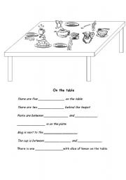 English Worksheet: on the table