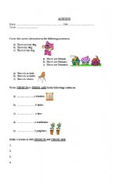 English worksheet: THERE IS THERE ARE