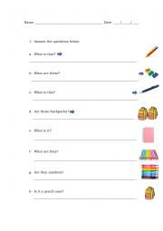 English Worksheet: Demonstrative, Verb to be and School Supplies